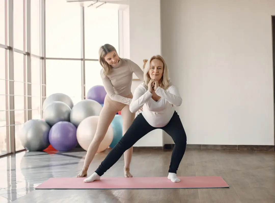 fitness instructor and client doing exercises